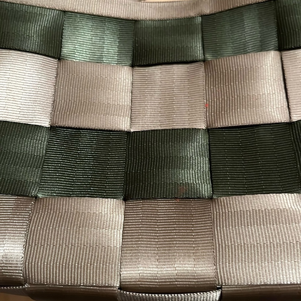 Harvey’s original seatbelt bag in champagne and army green. Like new condition.